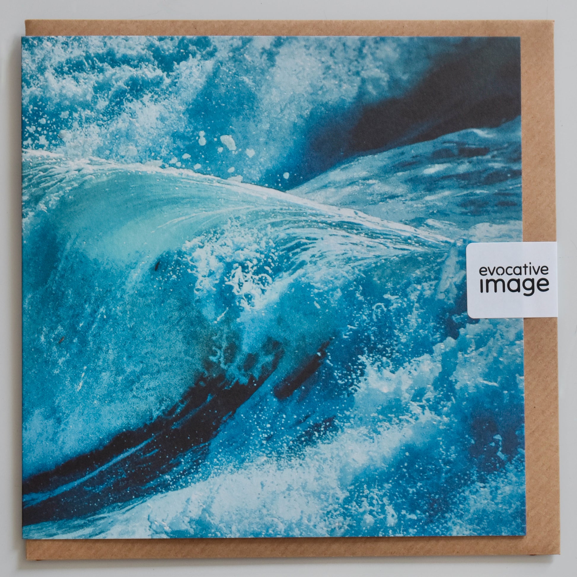 Abstract coastal art card, moody, blue tones and waves, evocative image, with envelope